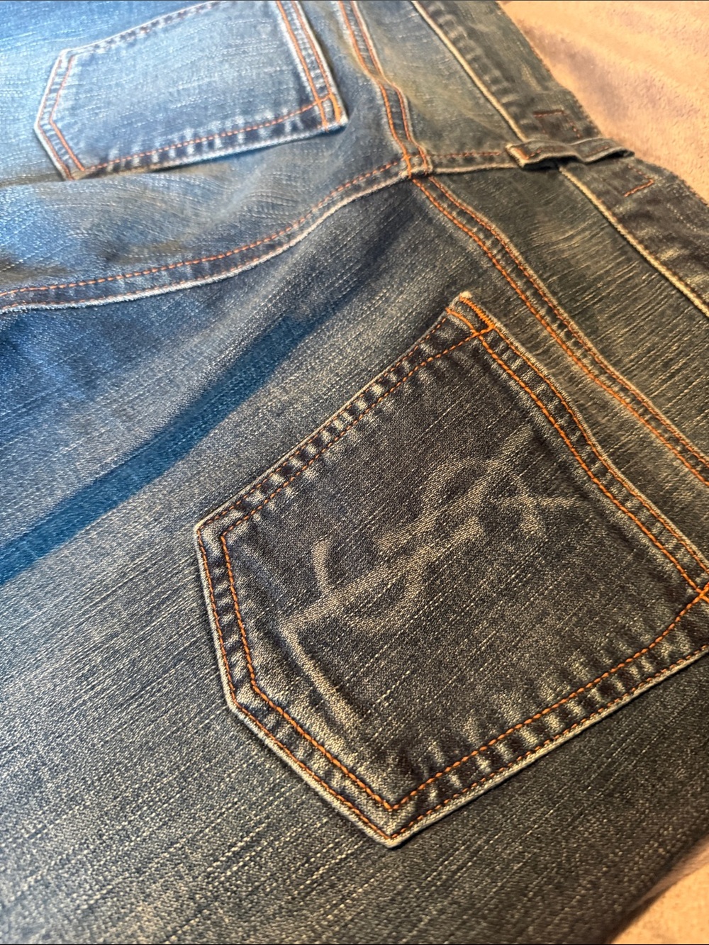 Yves Saint Laurent Men's Blue Denim Relaxed Jeans with Back Pocket Detail